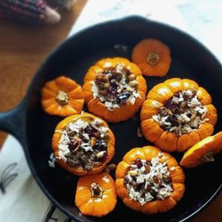 Basmati Sausage and Cranberry Stuffed Mini Pumpkin Bowls recipe served in iron skillet