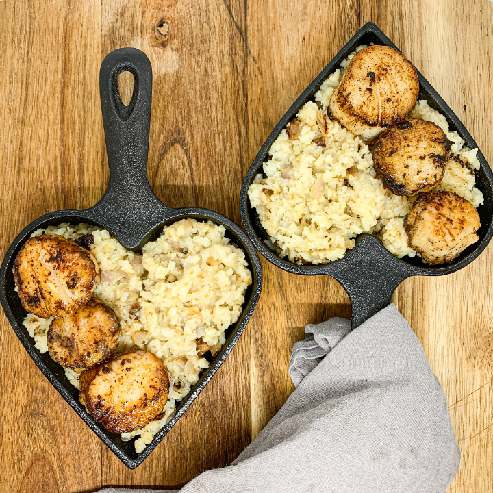 cooked rice dish served in heart cast iron pans